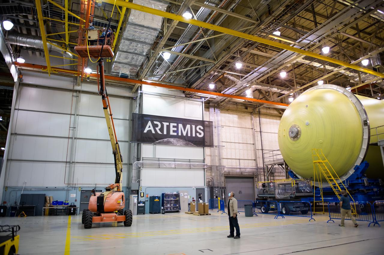 Employees wear personal protective gear at  Michoud Assembly Facility as the facility transitioned to Stage 3 of NASA’s Framework for Return To On-Site Work. Employees wear the appropriate personal protective equipment (PPE) and/or cloth face coverings as required for assigned tasks. Access to the facility is limited to authorized personnel working on mission-critical tasks that must be conducted onsite. Mission-critical tasks include slowly and methodically resuming Space Launch System (SLS) Core Stage and Orion production activities, particularly critical path deliverables to support the Artemis Program, at a pace that limits personnel and follows federal guidelines for social distancing and use of personal protective equipment such as face masks. For more information about SLS, visit nasa.gov/sls.